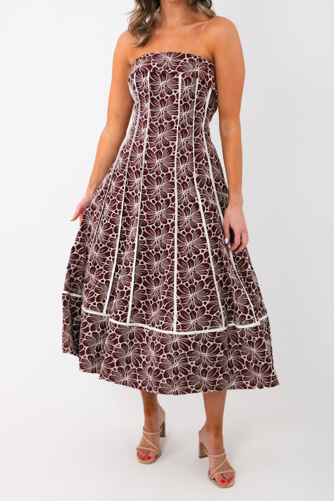 Close-up front view of the Scarlet Garden Floral Strapless Dress highlighting intricate burgundy floral embroidery and structured bodice.