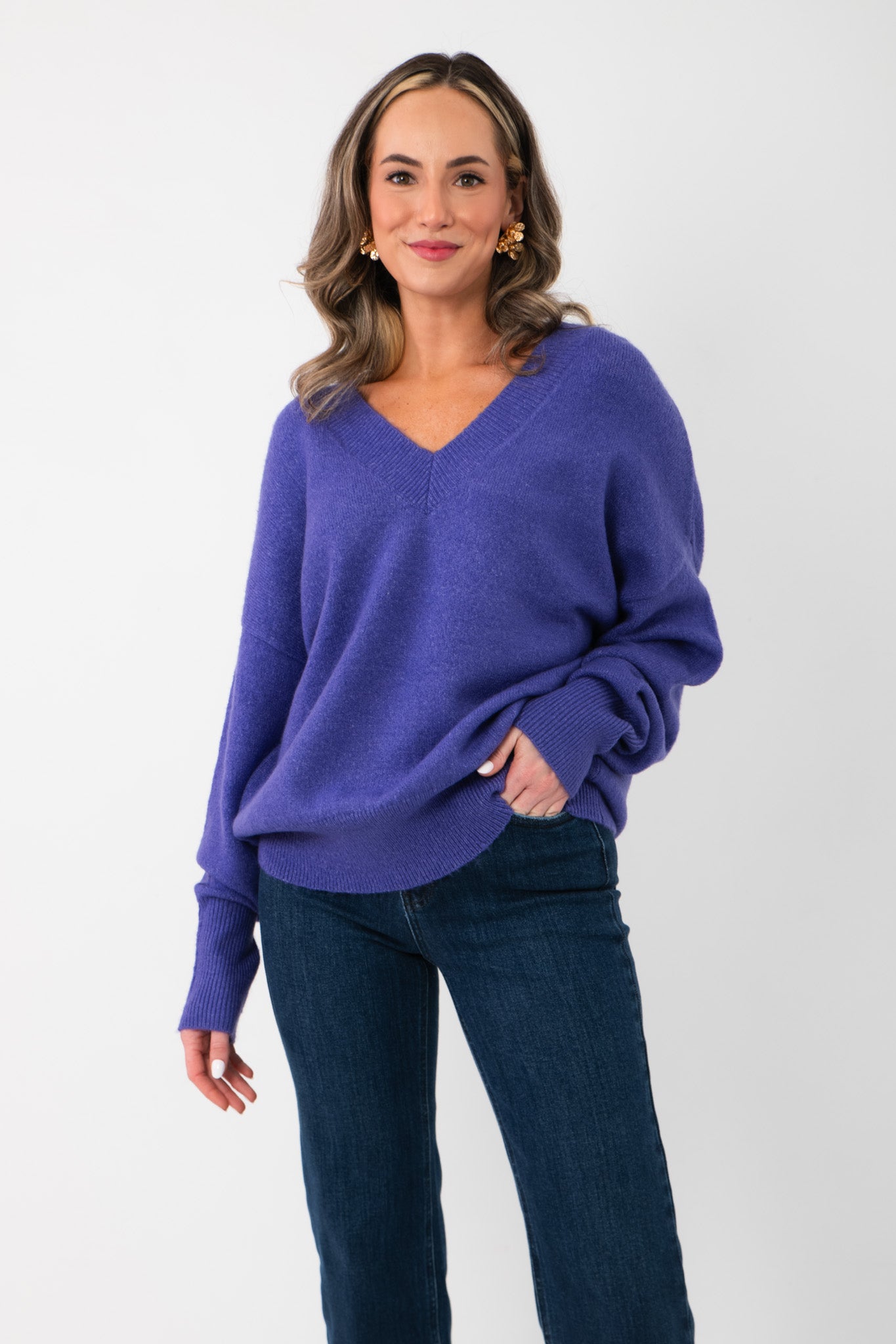 Cozy Olivia Oversized Purple V‑Neck Sweater in soft knit, featuring long sleeves and slouchy silhouette, perfect for winter layering.