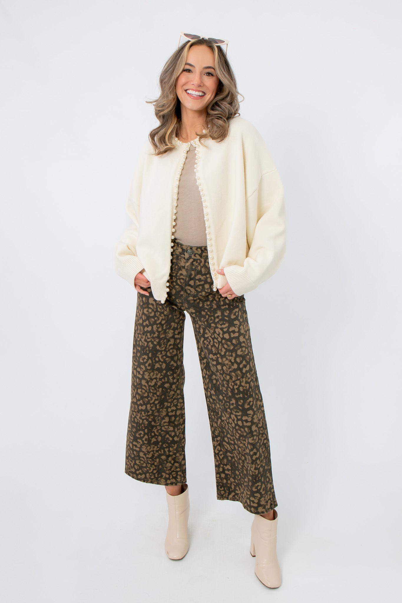 Laura Ivory Pearl Cardigan – Open front ivory knit cardigan with pearl accents, perfect for spring events or bridal wear.