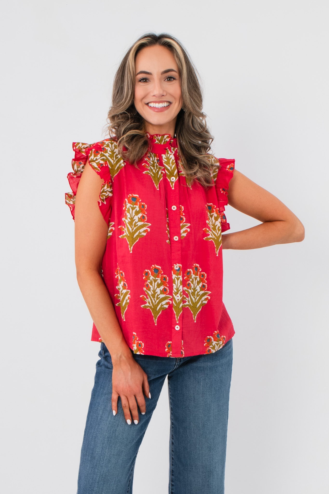 Front view of THML Magenta Floral Block Print Top featuring button-down front, sleeveless ruffle design, and lightweight fabric for spring wear.