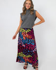 Model wearing Neon Prowl Animal Print Silky Skirt featuring vibrant multi-animal prints and a soft, luxe finish, ideal for stylish occasions.