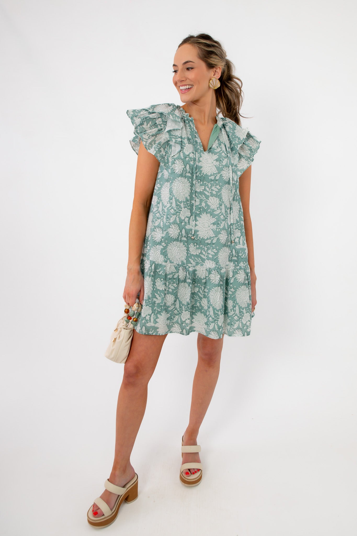 Lightweight Sullivan Seafoam Garden Bloom Ruffle Dress styled with wedge sandals, ideal for warm-weather outings and Easter events.