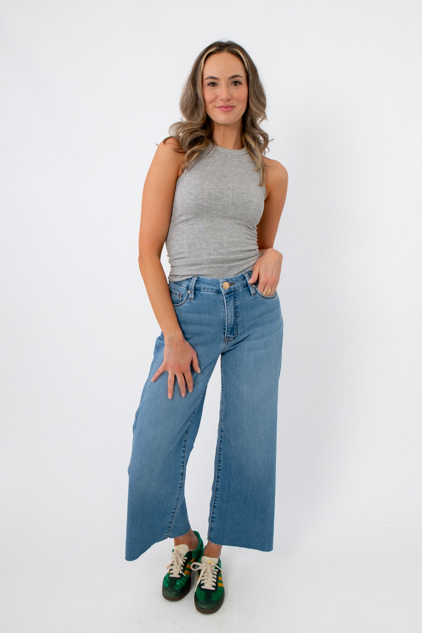 Full front view of Free People Heather Grey So Soft Seamless Modal Tank paired with denim, ideal for layering or relaxed outfits.