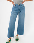Kut from the Kloth Deference Meg High Rise Jean in light blue denim with wide leg cut and sleek high waist fit, ideal for casual wear.