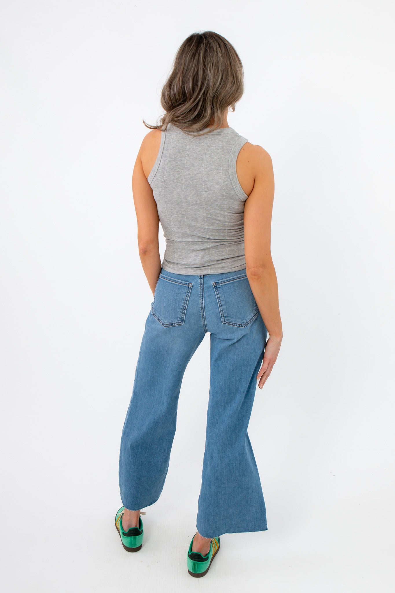 Back view of Free People Heather Grey So Soft Seamless Modal Tank revealing its racerback style and smooth, seamless finish.