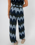 Back view of Retro Wave Metallic Knit Cropped Pant highlighting metallic knit texture and relaxed fit.