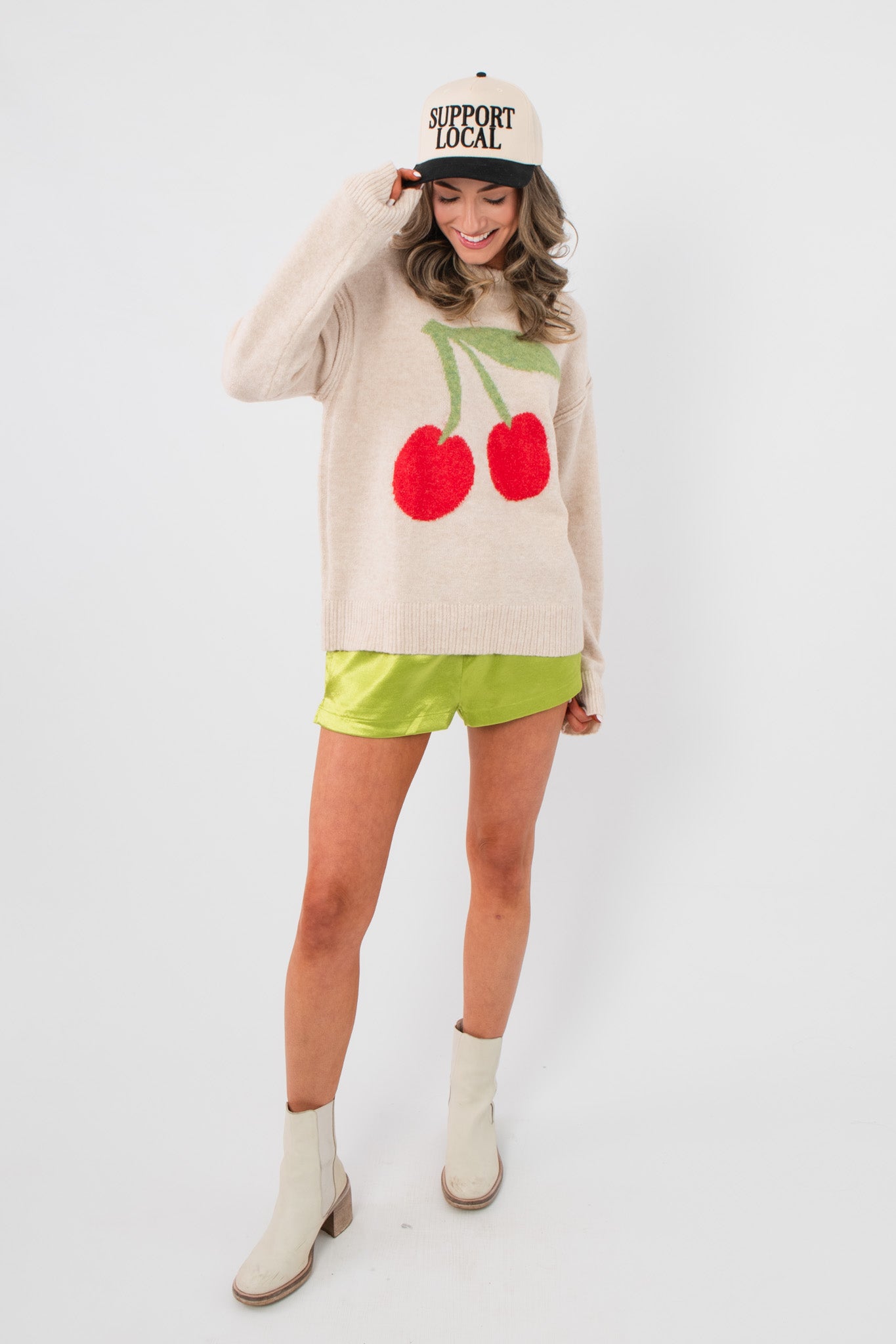 Key Lime Green Silky Shorts - Stylish Comfort Summer Wear paired with a cherry sweater and white boots, ideal for casual summer looks.