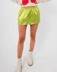 Close-up of Key Lime Green Silky Shorts with elastic waistband and smooth finish, perfect for trendy summer comfort and lounging.