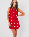 Cherry Cola Polka Dot Mini Dress in red satin with white polka dots, sleeveless high neck design, ideal for summer parties or wedding guest looks.