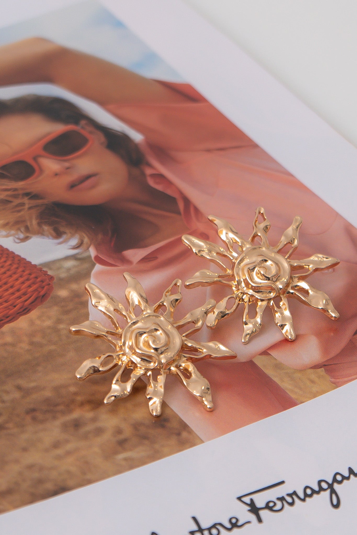 Gold Textured Sun Earrings – Elegant gold stud earrings with a radiant sunburst design, ideal for summer fashion and special occasions.