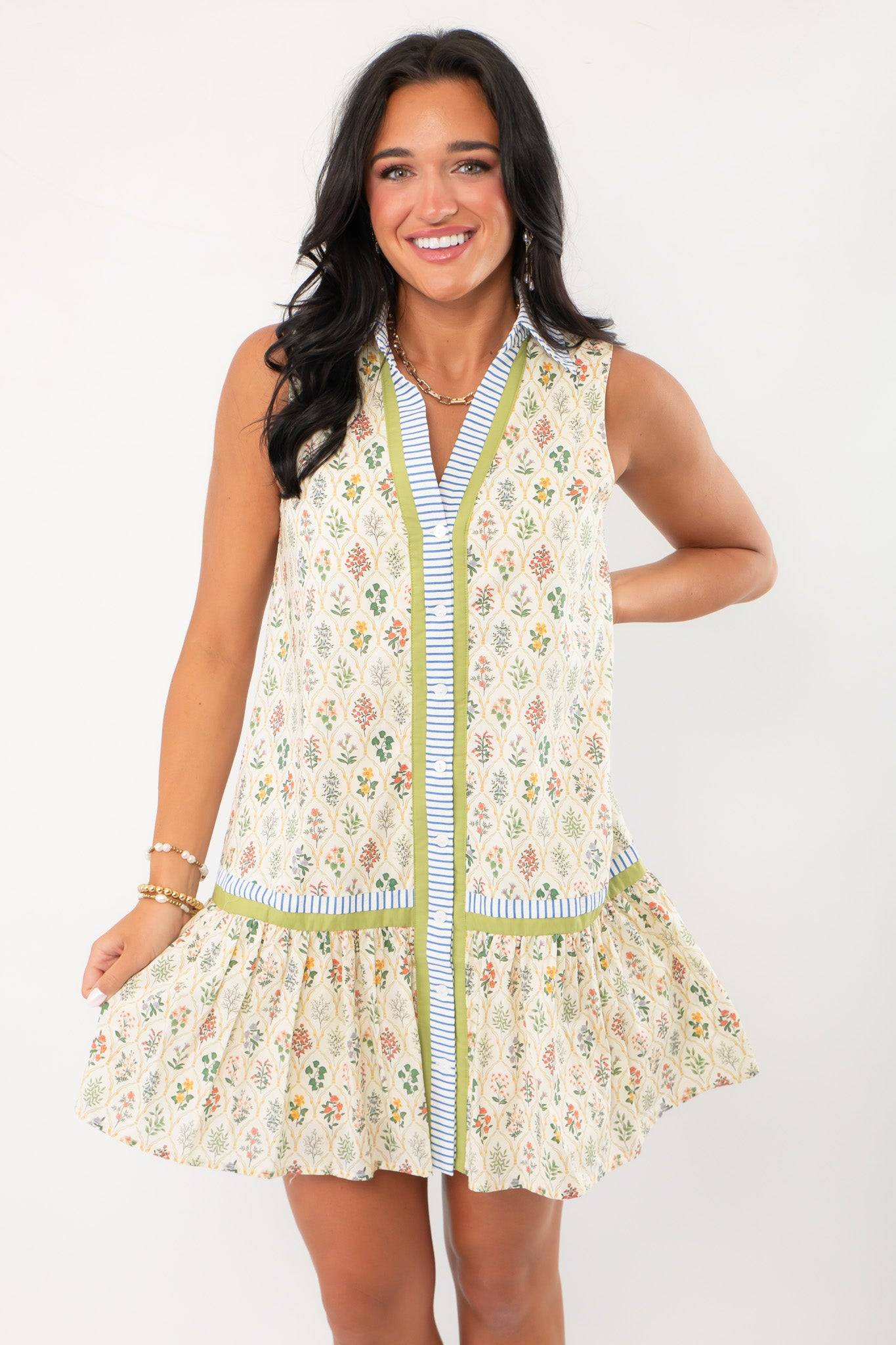 Close-up front view of the Gracelyn Vintage Floral Button Down Dress with striped button placket and drop waist for a timeless vintage look.