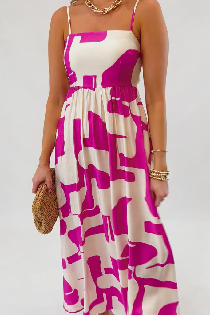 Close-up of Meet Me in Santorini Fuchsia Wave Maxi Dress showing square neckline, fitted bodice, and vibrant fuchsia wave pattern.