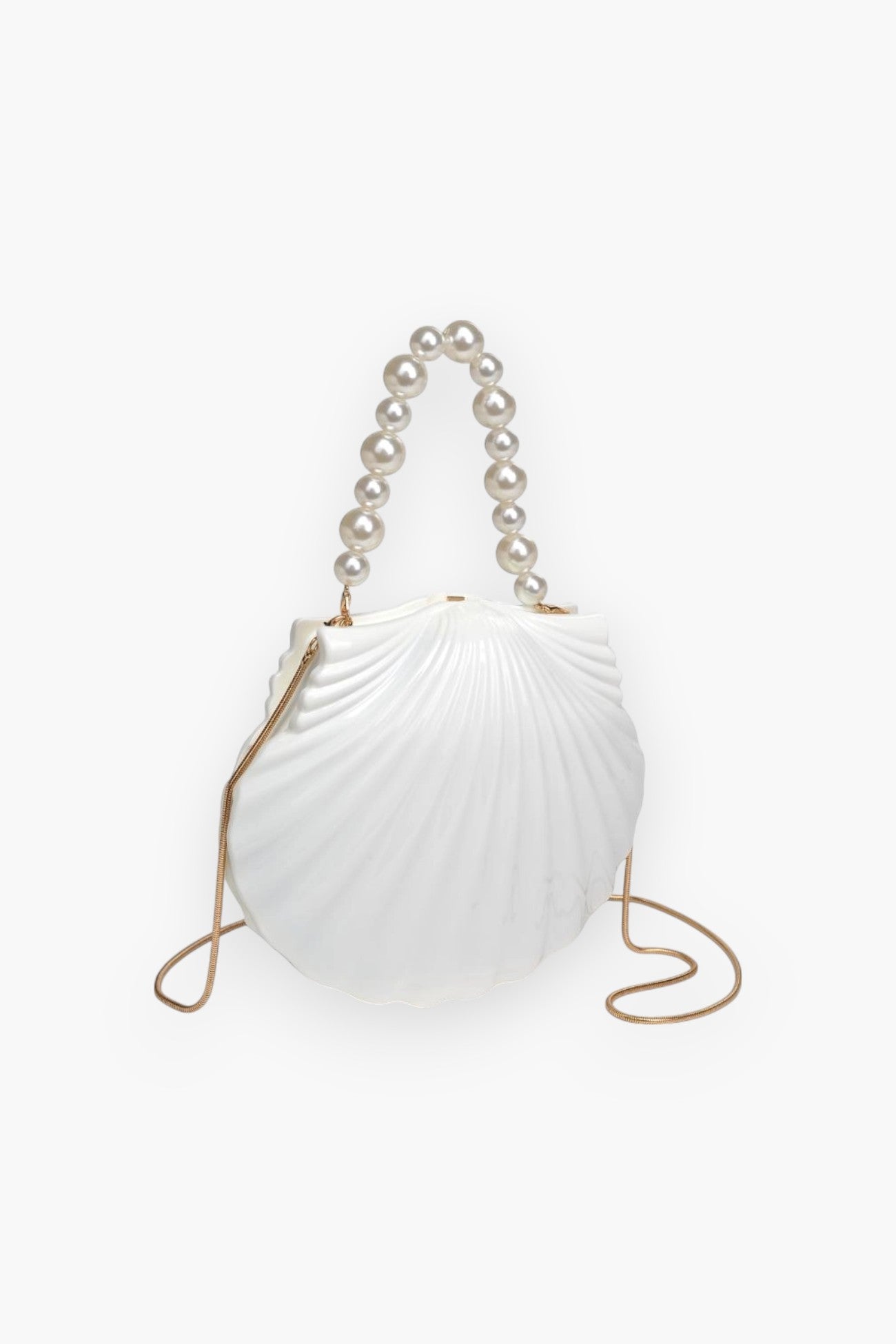 Side view of Shore Thing Clutch showing scallop shell design, pearl strap, and gold crossbody chain, perfect for vacation or evening wear.