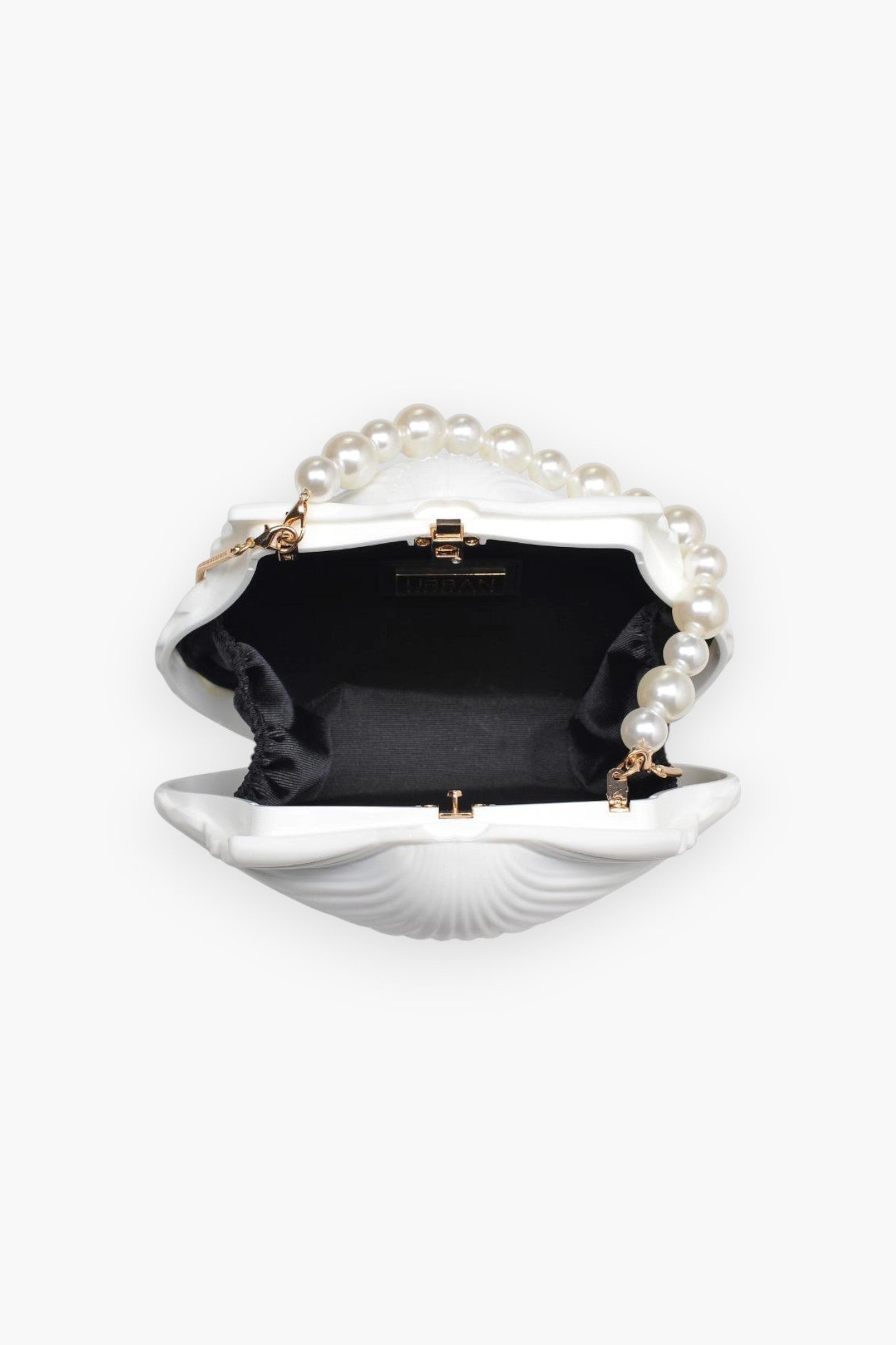 Interior of Shore Thing Clutch revealing black fabric lining and spacious compartment, combining elegance with functionality for day-to-night use.