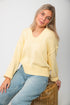Lemon Sorbet Scoop Neck Sweater in oversized butter yellow knit with ribbed hem and cuffs, styled with light wash jeans for spring.