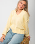 Lemon Sorbet Scoop Neck Sweater in oversized butter yellow knit with ribbed hem and cuffs, styled with light wash jeans for spring.