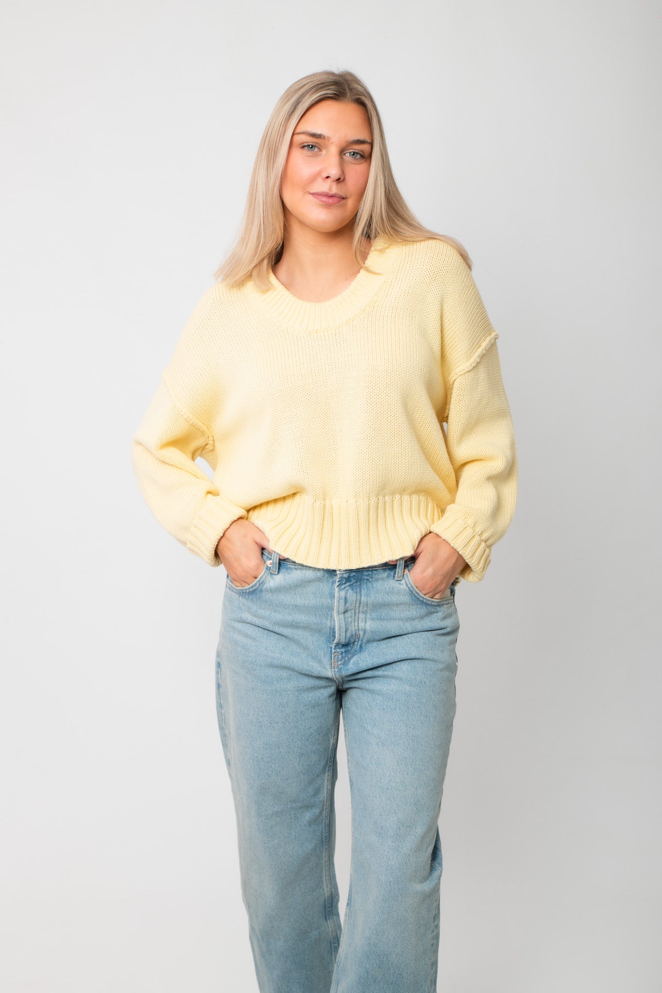 Front view of Lemon Sorbet Scoop Neck Sweater – oversized butter yellow knit top with relaxed fit and scoop neckline, ideal for layering.