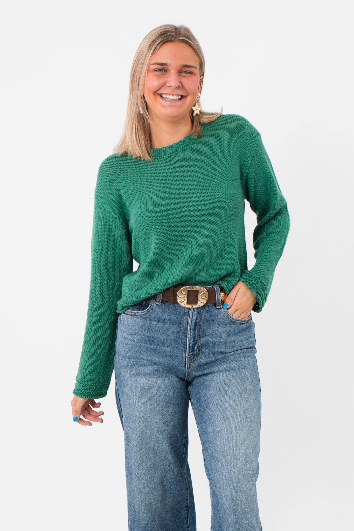 Z Supply Botanical Green Emerson Sweater with breezy open weave and textured trim, styled with high-waisted jeans for a casual boho look.