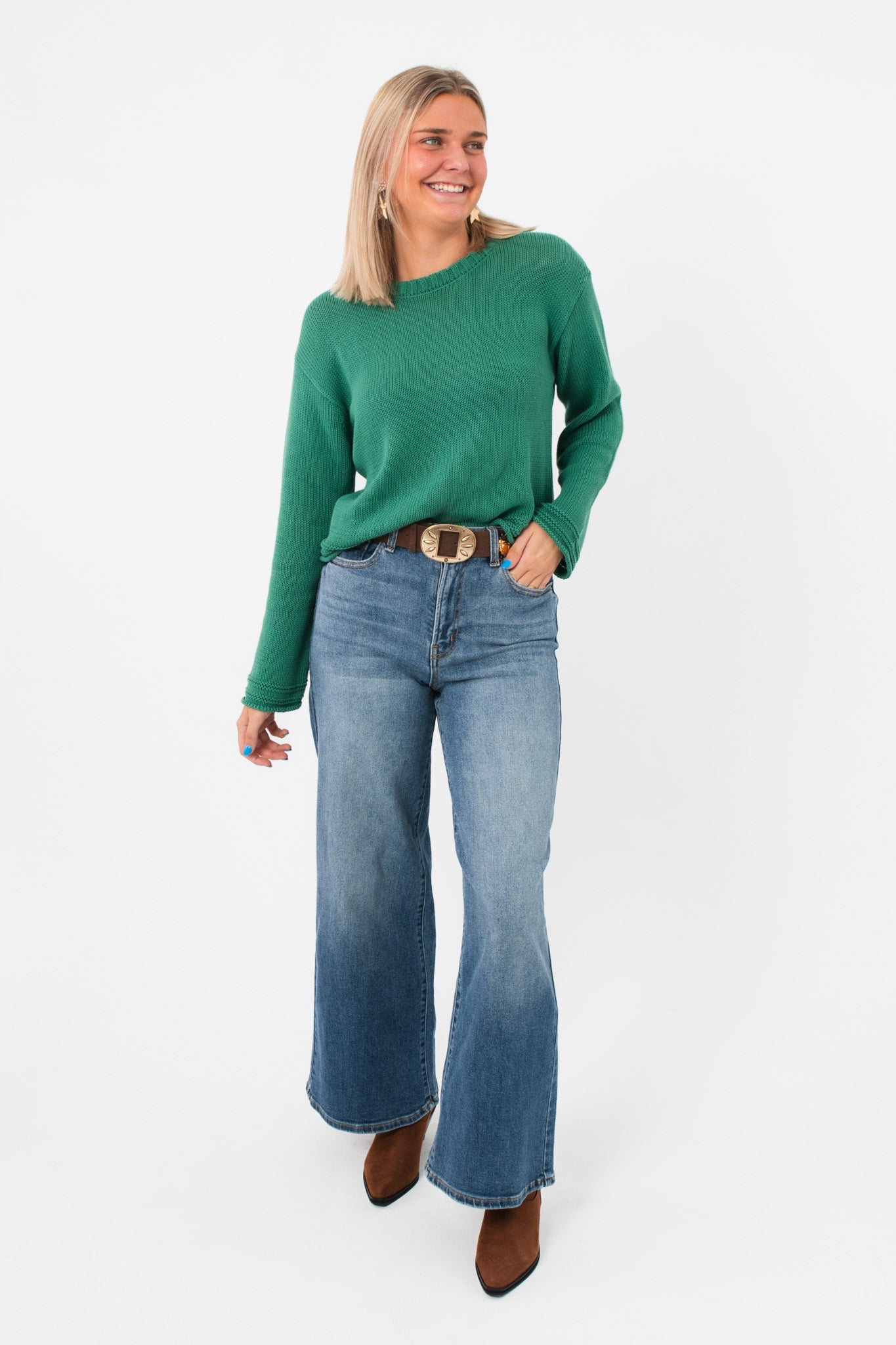 Full front view of Z Supply Botanical Green Emerson Sweater styled with flared jeans and boots, perfect for a relaxed bohemian outfit.