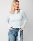 Icey Blue Ribbed Mock Neck Sweater – Soft ribbed texture and slim fit design, ideal for layering under jackets or scarves in cool weather.