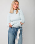 Icey Blue Ribbed Mock Neck Sweater – Fitted knit top with long sleeves and mock neckline, styled with high-waisted jeans for a cozy layered look.