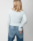 Icey Blue Ribbed Mock Neck Sweater – Back view showing ribbed knit detail and cropped hem, perfect for pairing with high-rise denim.