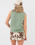 Back view of Mila Desert Sage Green Knit Sleeveless Sweater highlighting ribbed hem and soft knit texture. Stylish sleeveless top for casual outfits.
