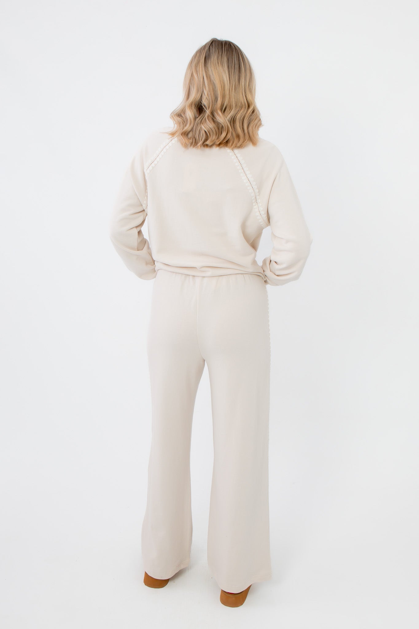 Rear full-body view of Z Supply Crystal All Around Sweatshirt and matching pants, showcasing the cozy lounge set in neutral cream tone.