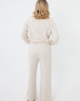 Rear full-body view of Z Supply Crystal All Around Sweatshirt and matching pants, showcasing the cozy lounge set in neutral cream tone.